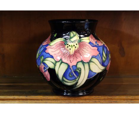 A MOORCROFT "ANNA LILY" VASE, Christmas Market colourway, first quality. 16cm