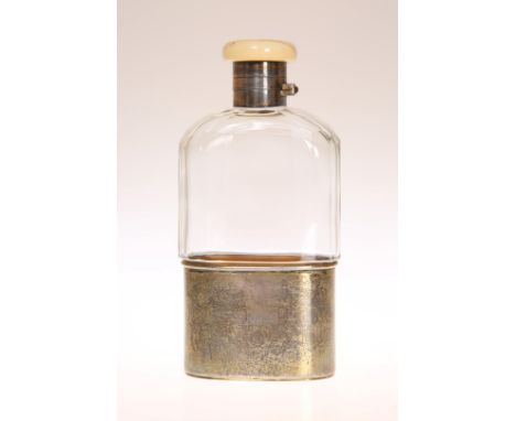 A GEORGE V SILVER AND IVORY HIP FLASK, London 1926, the ivory top initialled S.M.H. 15.5cm