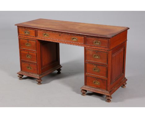 AN ANGLO-INDIAN TEAK CAMPAIGN DESK, the moulded rectangular top with three frieze drawers over a pair of pedestals each fitte