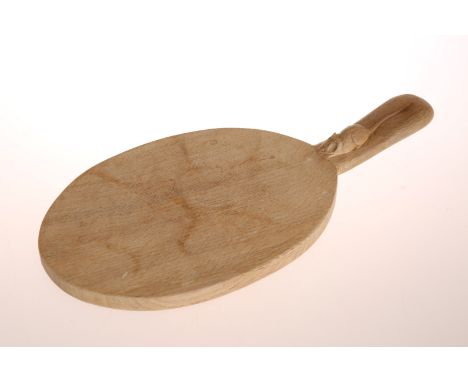 ROBERT THOMPSON OF KILBURNA MOUSEMAN OAK CHEESEBOARD, of characteristic form, with carved mouse signature. 38cm