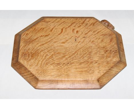 ROBERT THOMPSON OF KILBURNA MOUSEMAN OAK BREADBOARD, of typical form, carved mouse signature. 30.5cm by 25cm