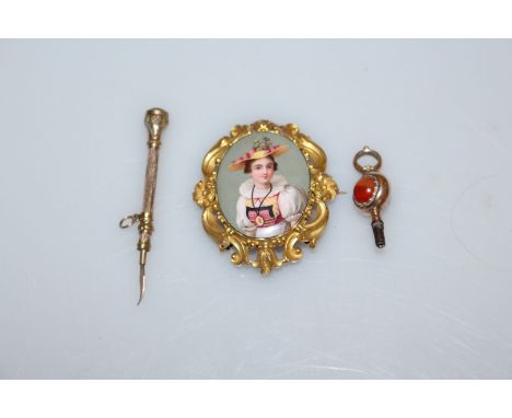 AN ENAMEL AND GILT METAL BROOCH, set to the centre of a moulded floral detail mount with an oval enamelled plaque of a young 