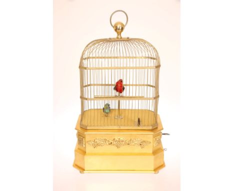 A COIN-OPERATED GILTWOOD AND GILT-METAL SINGING BIRD AUTOMATON, the domed cage enclosing two birds, in coloured feathers, mov