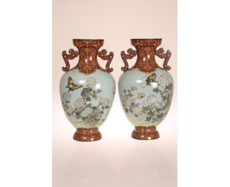 A PAIR OF JAPANESE CLOISONNE ENAMEL VASES, MEIJI PERIOD, of oval section baluster form with twin shoulder handles, each decor