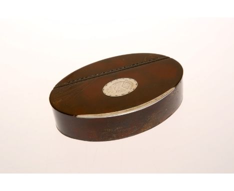 A GEORGE III SILVER-MOUNTED LEATHER TABLE SNUFF BOX, c. 1790, of oval form, the hinged cover with a silver escutcheon engrave