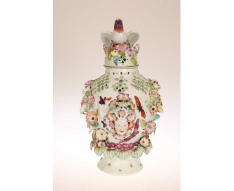 A DERBY PORCELAIN POT-POURRI FRILL VASE, c. 1770, of baluster form, the cover with bird finial, the floral-encrusted body wit