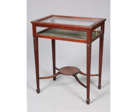 AN EARLY 20TH CENTURY MAHOGANY BIJOUTERIE TABLE, the hinged top with bead and reel edge, the square tapering legs decorated w