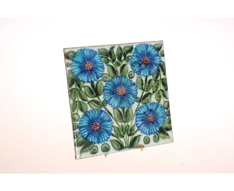 A WILLIAM DE MORGAN TILE, painted with a spray of blue flowers, unmarked. 15cm square