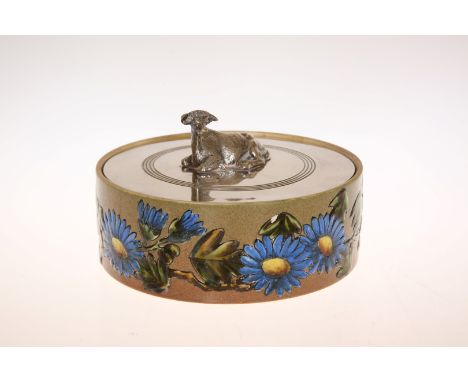 A LINTHORPE POTTERY BUTTER DISH, circular, enamel painted to the sides with flowers and foliage, the silver-plated cover with