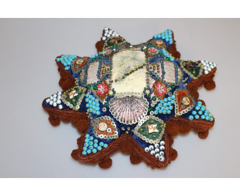 A FIRST WORLD WAR SWEETHEART CUSHION, of star shape, elaborately decorated with coloured beads, printed portrait miniatures, 