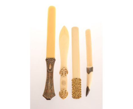 A LATE 19TH CENTURY SILVER-MOUNTED IVORY PAGE TURNER AND THREE IVORY LETTER OPENERS, the Continental page turner with silver 