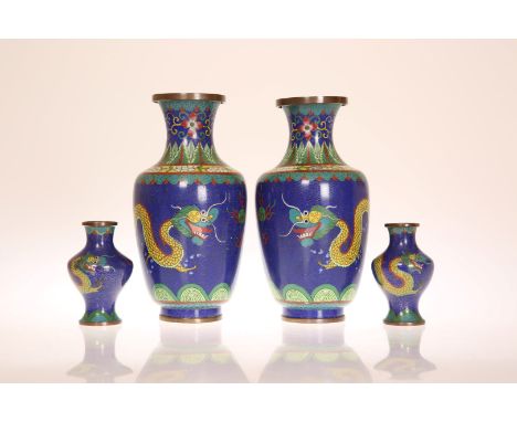A PAIR OF CLOISONNE VASES, CIRCA 1920, of baluster form, each decorated with twin dragons and flaming pearl against a blue gr