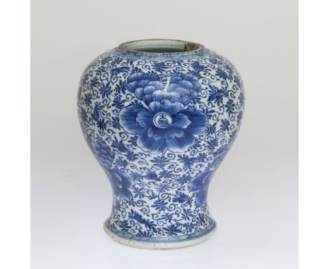 A CHINESE BLUE AND WHITE JAR, PROBABLY KANGXI PERIOD, painted with scrolling foliage and tendrils, cut down, concentric doubl