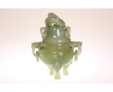 A CARVED JADE CENSER AND COVER, the cover with zoomorphic knop and ring handles, the censer with mask ring handles, raised on