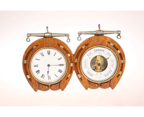 AN EDWARDIAN OAK AND BRASS DESK CLOCK AND BAROMETER, each with white enamel dial, the clock with Roman numerals, in a case ca