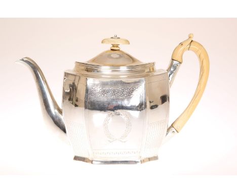 A GEORGE III SILVER TEAPOT, LONDON 1804, maker's mark indistinct, of faceted oval form, with engraved bands, and scroll-carve