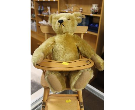 A STEIFF BEAR IN CHILDREN'S HIGH CHAIR  (01655)