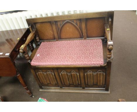 AN OAK LINEN FOLD MONKS BENCH