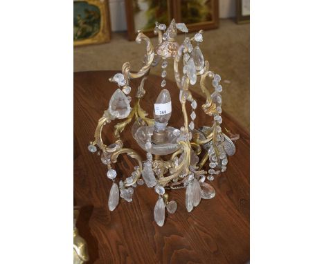 A small brass and cut glass single ceiling light fitting