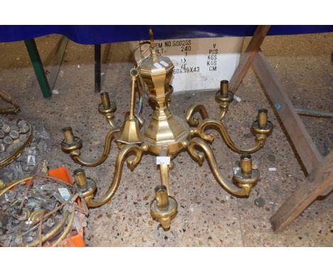 A pair of 20th Century brass eight branch ceiling light fittings with scrolled arms