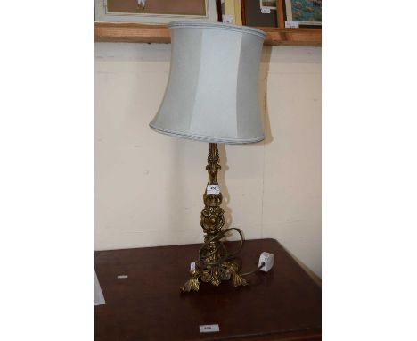 A 20th Century table lamp with cast brass foliate decorated base