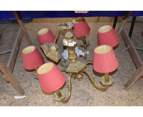 Brass six branch light fitting with red shades