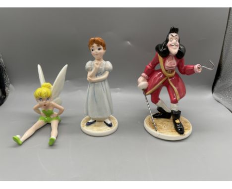 THREE CERAMIC PORCELAIN DISNEY FIGURINES; TINKERBELL, WENDY AND CAPTAIN HOOK
All in great condition, no damage