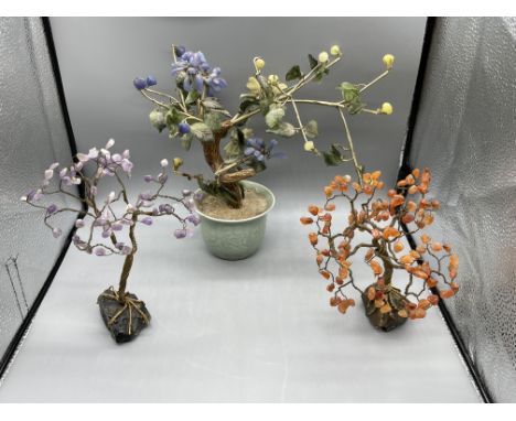 An oriental hardstone flowering bush in ceramic pot 9" high and A Pair of hardstone oriental wired trees. 7" high
