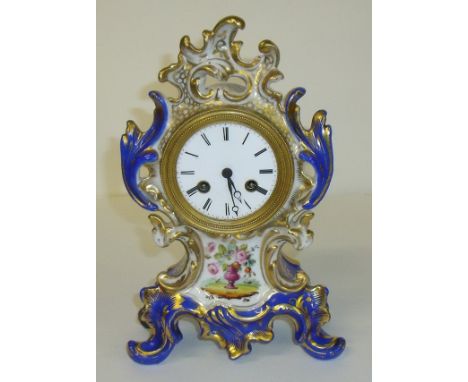 Coalport style 19/20th C ceramic clock with hand painted floral spray and enamel dial and gilt finishing