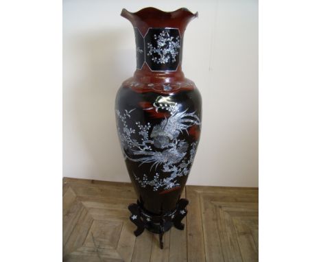 Extremely large lacquered papier mache oriental floor vase mounted on two tier base with mother of pearl detail (height 120cm