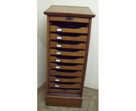 Edwardian oak upright filing chest with roller shutter door and multiple slide out trays (49cm x 44cm x 112cm)