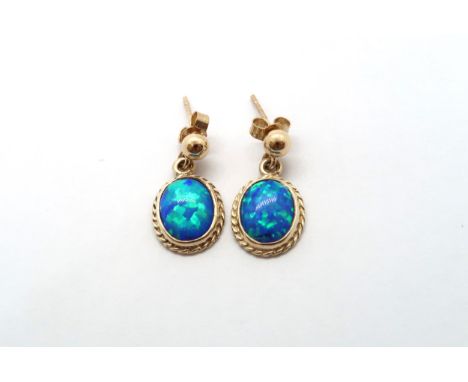 A 9ct yellow gold opal earrings, head size including ball mounts 20mm x 11mm 