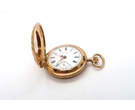 A 14ct Yellow gold cased hunter pocket watch, the white enamel dial with roman numerals and subsidiary seconds hand at 6 o'cl