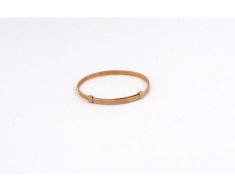 A child's adjustable bangle. Stamped 14K. Weight 4.29 grams. 