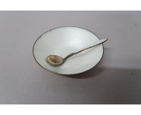 A David Anderson (Norwegian) Silver gilt and enamel salt with spoon, decorated with white enamel to centre of bowl and to han