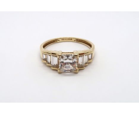 A 9ct yellow gold square cut topaz ring with baguette cut shoulders, head size approx 19mm x 8mm, size Q/R 