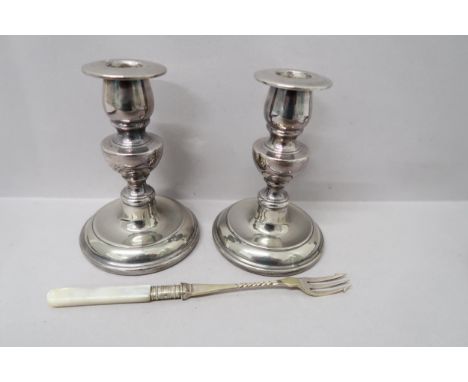 A pair of silver plated candlesticks and toasting fork 