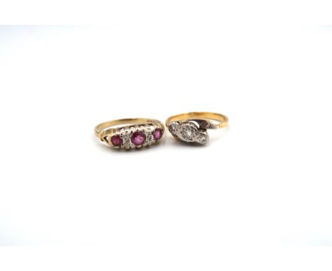 A three stone single cut diamond crossover ring, estimated total weight 0.08ct, tested gold 18ct, weight 2.96 grams, size L; 