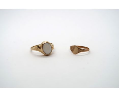 A yellow gold and opal ring unmarked, size O, approx 3 grams, a 9ct child's ring, size E, approx 0.65 grams 