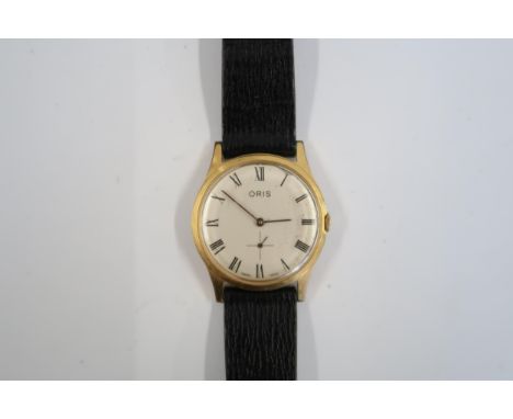 A Gents Oris manual watch on a brown leather strap, running  in saleroom 