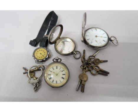 A silver hallmarked full hunter pocket watch, a German silver pocket watch with Roman numerals to enamel dial and a white met