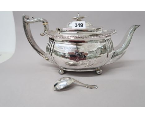 A silver tea pot and a silver caddy spoon - approx weight 22 troy oz - hallmarks rubbed 