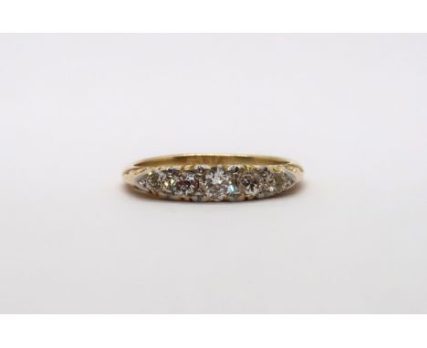 An 18ct yellow gold Edwardian 5 stone diamond ring, diamonds are well matched, head size approx 16mm x 4mm, size K 