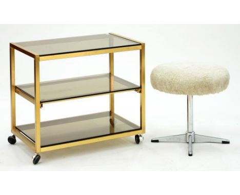 A 1970'S THREE TIER GLASS TROLLEY AND A DRESSING STOOL ON CHROMIUM BASE 
