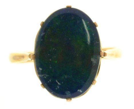 A BLACK OPAL TRIPLET RING, IN GOLD, 3G, SIZE R++GENERAL SCRATCHES AND WEAR CONSISTENT WITH AGE