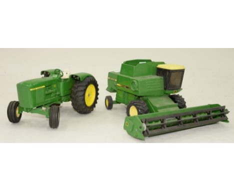 A DIE-CAST MODEL JOHN DEER TRACTOR AND HARVESTER 