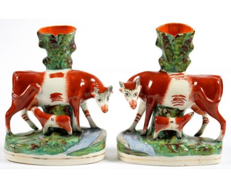 A PAIR OF STAFFORDSHIRE EARTHENWARE COW AND CALF SPILL HOLDER GROUPS, 27CM H, 19TH C, A SALTGLAZED BROWN STONEWARE 'NOTTINGHA