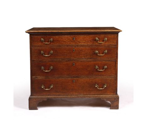 A GEORGE III OAK SMALL SIZED CHEST OF FOUR GRADUATED DRAWERS with swan neck handles and bracket feet, 92cm wide x 53cm deep x