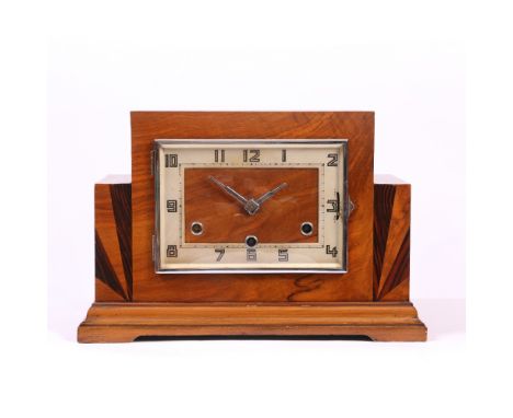 AN ART DECO STYLE WALNUT MANTLE CLOCK with stepped case and parquetry inlay, he silvered rectangular dial with Arabic numeral