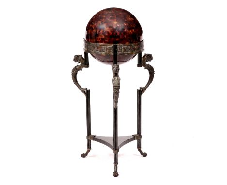 A DECORATIVE ROMAN INSPIRED FLOOR LAMP with spherical shade on a bronzed stand with cast leopard's head mounts, cluster colum